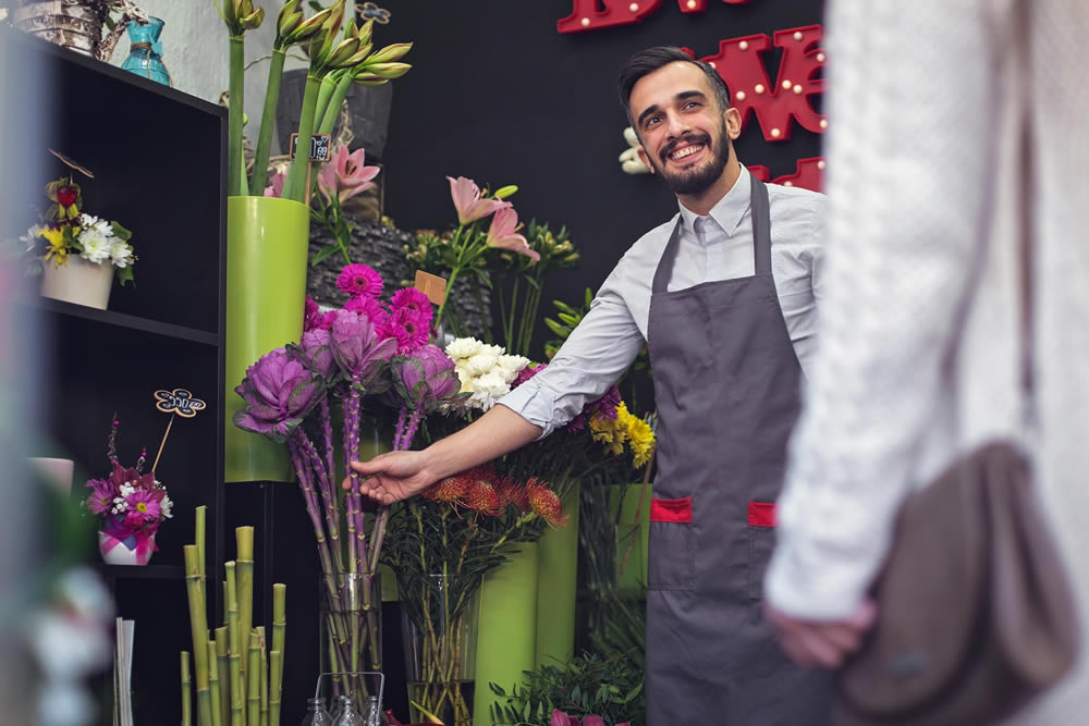 Man serving flowers in florist